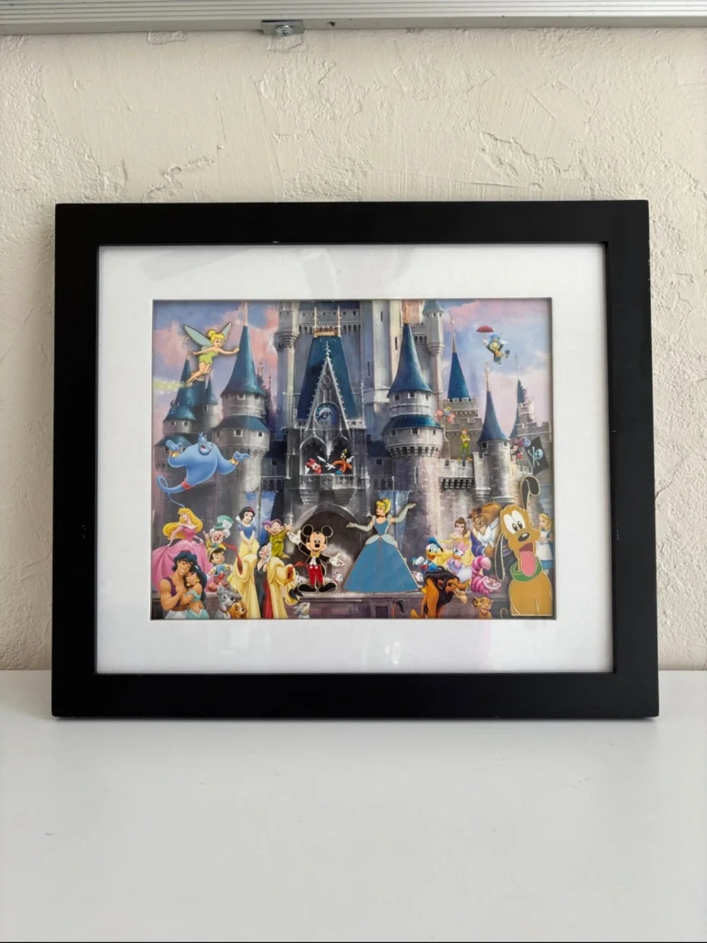 Disney Cinderella Castle lithograph print that includes four‎ collectible pins